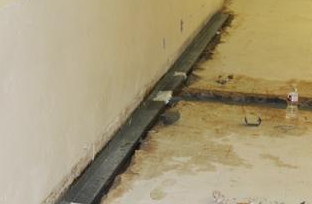 Lakehoma Elementary School - Challenge

Lakehoma Elementary school in Mustang Oklahoma was dealing with the entrance of unwanted water into several classrooms on the lower level of their building. This school is split level, meaning that the bottom underground level is susceptible to the leaking and pouring in of rainwater. The school knew that it could no longer deal with this water entering the classrooms so they reached out to us for a free, no-obligation inspection. Our diagnostics and design manager Craig Ruiz went out to the school and proposed a solution that would keep the split level school dry all the time. 
Solution

After a thorough inspection, Craig proposed that the school move forward with a full waterproofing of the lower level. This would include the installation of 365 ft of water guard, 150ft of Drytrak, 8 triple safe sump pumps, 388 ft of Brightwall, 279 ft of Cleanspace, and 8 Sanidry XP dehumidifiers. The install of these products will ensure that the school stays 100% dry, 100% of the time. After the proposal, the school was ready to move forward and take the steps the complete the job. 

The first step of the install was dust-proofing the area, making sure that the building would stay clean and safe while getting the project done. After the lower level was dust-proofed and ready the team began to install the system. There are 8 classrooms that were directly affected by the water so each classroom was equipped with its own waterproofing system including a sump pump and dehumidifier. The System was strategically placed to be out of the way and reduce added noise to the classrooms. The Vesta production team worked diligently to ensure that the install was smooth and efficient. 

We are very happy to have gotten the opportunity to work with Lakehoma Elementary!