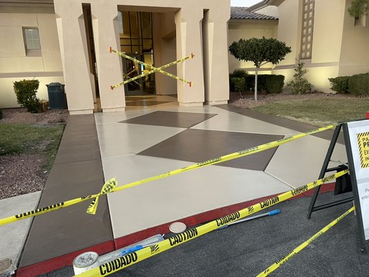Concrete Sealer Tinted Color - Concrete sealer tinted color sealer at Revere Golf coarse entrance.  Tinted poly urethane in light and dark brown are the chosen tinted concrete sealers. All prep work was done with acid citrus wash scrubbing. Designed to have minimal dirt tracking and hi gloss with anti skid.  
Concrete Restored is a specialty concrete floor painting contractor.  Nevada State contractor # 00084999.  Concrete Restored specializes in concrete staining, concrete sealing, concrete cleaning, concrete grinding, concrete polishing, resilient concrete, epoxy, metallic epoxy, garage floor epoxy, brick paver sealer, pool deck coating, and pressure washing. Concrete Restored offers these specialties on walkways, courtyards, patios, driveways, garage floors, brick pavers, pool decks, commercial store fronts, business concrete floors, residential home concrete floors, and industrial warehouses.  Concrete Restored only offers the best material from concrete Accessaries, PPG, Dunn Edward’s, Sherwin Williams, Home Depot, Lowes, Ace Hardware, and decorative concrete supply.