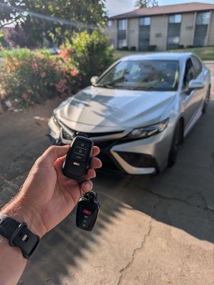 Toyota Camry 2022 smart key add - Project: Added a new spare key for a 2022 Toyota Camry. The customer lost one of the keys and wanted a backup without affecting the original. We came on-site, programmed the new key, and made sure it worked seamlessly with the vehicle. Fast, reliable, and no towing required.