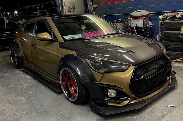 Hyundai Veloster WideBody Kit & Full Custom Paint Jo - Our loyal customer wanted to get these Carbon Fiber Widebody Kit installed in this immaculate Hyundai Veloster. We went ahead and gave this project and Full Inside & Outside Custom Rose Gold Paint Job.