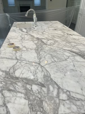 Kitchen ISLAND RESTORATION - Kitchen island was restore ,sanded to remove stains and scratches then it was polish and seal we also change the silicone around the sink .
