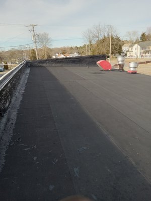 Commercial Flat Roof Project - This is our Snow Hill "Chicken Man" store, where they were experiencing leaks in multiple sections on a worn flat roof. They even had some spots where water was coming into the store, no good for business! We prepped the roof and installed new rolled roofing as well as new asphalt shingles on the pitched roof section getting rid of the water and adding years of worry free use for this business owner. Commercial Flat Roof Project - This is our Snow Hill "Chicken Man" store, where they were experiencing leaks in multiple sections on a worn flat roof. They even had some spots where water was coming into the store, no good for business! We prepped the roof and installed new rolled roofing as well as new asphalt shingles on the pitched roof section getting rid of the water and adding years of worry free use for this business owner.