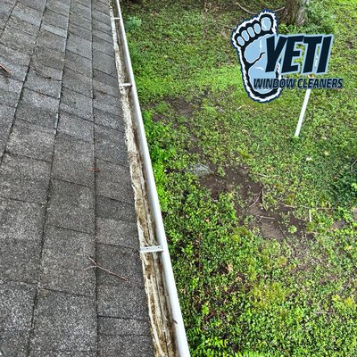 Gutter clean out and gutter guard installation ￼ - Customer was cleaning out his gutters about four times a year. He called Yeti Window Cleaners to come out and clean them out and install new gutter guards.