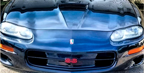 2001 SS Camaro - Before and after front of a 2001 SS Camaro. Did body work and painted the hood. Restored both headlights as well. What a difference that makes.