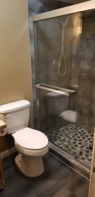 Remodel shower - There was a leak in the shower pan, found out it was not sealed properly so we decided to demo shower and build new. We built new custom shower pan, installed new tile on walls with new fixtures and glass sliding door. While we were at it we also replaced the tile flooring.