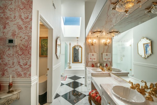 Luxurious Bathroom Remodel - Step into a dream! See this luxury master bath with an crystal chandelier & ornate gold swan faucet. Luxurious Bathroom Remodel - Step into a dream! See this luxury master bath with an crystal chandelier & ornate gold swan faucet.