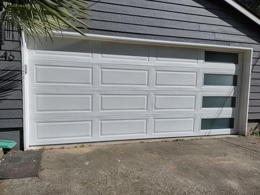 Garage Door in West Seattle - We installed this modern ranch style door at a home in West Seattle. It's a sleek modern look that fits right in with the neighborhood and let's the perfect amount of light in! These doors are pretty affordable and installed in just a few hours. Garage Door in West Seattle - We installed this modern ranch style door at a home in West Seattle. It's a sleek modern look that fits right in with the neighborhood and let's the perfect amount of light in! These doors are pretty affordable and installed in just a few hours.
