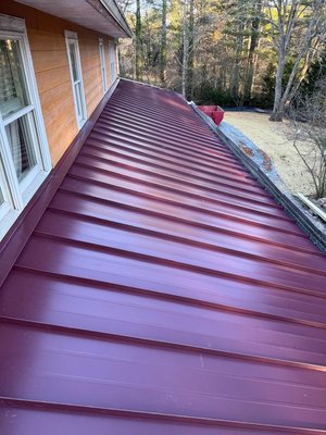 Burgundy Standing Seam Metal Roof – Mountain Cabin Retreat - This striking red roof brings bold character and long-lasting protection to a peaceful cabin in the mountains. We installed architectural-grade standing seam panels, perfect for high-wind areas and dramatic seasonal changes. The vibrant color choice reflects the owner's personal style while enhancing curb appeal — a perfect fit for the wooded setting and rustic-modern vibe of the home. Burgundy Standing Seam Metal Roof – Mountain Cabin Retreat - This striking red roof brings bold character and long-lasting protection to a peaceful cabin in the mountains. We installed architectural-grade standing seam panels, perfect for high-wind areas and dramatic seasonal changes. The vibrant color choice reflects the owner's personal style while enhancing curb appeal — a perfect fit for the wooded setting and rustic-modern vibe of the home.