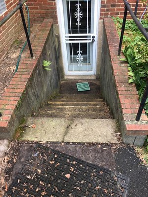 Turned a walk up useless basement into a walk out basement with an 8 foot wide window and finished with stone and brick - Turned a useless walk basement into a beautiful walk out basement with an 8’ wide window