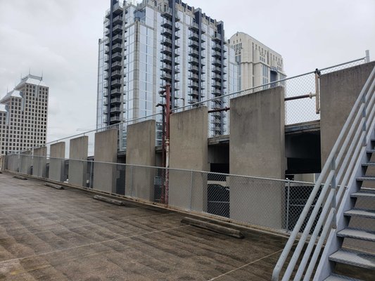 Commercial Project Downtown Orlando - Our client for this project needed the damaged chain link fence in their parking garage replaced. We used a heavier duty chain link for durability. Call us today for your chain link project! We service residential and commercial properties all throughout Central Florida.