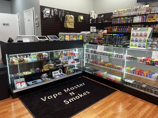 In-store Products! - At Vape Master N Smokes, we offer a comprehensive selection of products to meet all your vaping and smoking needs. From high-quality e-liquids, vape pens, and mods to a variety of accessories like coils, batteries, and chargers, we have everything you need. Plus, we carry an assortment of traditional smoking products, including rolling papers, pipes, and more. Visit us for a one-stop shop experience tailored to enthusiasts of all levels! In-store Products! - At Vape Master N Smokes, we offer a comprehensive selection of products to meet all your vaping and smoking needs. From high-quality e-liquids, vape pens, and mods to a variety of accessories like coils, batteries, and chargers, we have everything you need. Plus, we carry an assortment of traditional smoking products, including rolling papers, pipes, and more. Visit us for a one-stop shop experience tailored to enthusiasts of all levels!