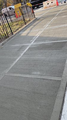 Concrete Sidewalk Replacement - Concrete sidewalk repair and replacement project completed in Brooklyn, NY. The old damaged sections were removed and replaced with freshly poured concrete featuring clean broom finish texture and precise control joints. The project improved both safety and curb appeal while delivering a clean, durable finish built to last. Concrete Sidewalk Replacement - Concrete sidewalk repair and replacement project completed in Brooklyn, NY. The old damaged sections were removed and replaced with freshly poured concrete featuring clean broom finish texture and precise control joints. The project improved both safety and curb appeal while delivering a clean, durable finish built to last.