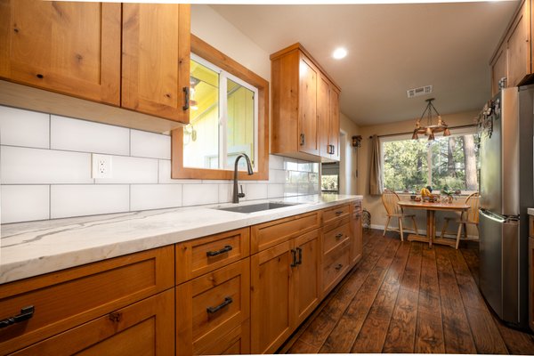 Rustic Comfort - Full Kitchen Remodel - This rustic cabin kitchen remodel needed some TLC to elevate its natural charm and craftsmanship. This design showcases the warmth of rustic wood tones and rugged textures, but introduced some cleaner lines, upgraded finishes, and modern amenities. The final result is a space that still feels grounded in its roots yet carries an elevated look that’s both inviting and sophisticated.
With our team we have a full service construction and design crew with the aid of our one-stop-shop materials gallery, Rocklin Kitchen & Bath Showroom. We can assist you in curating your beautiful design, with color curations, 3D rendering services, and samples for you to take home.
Contact us today to book a consultation with Guy Biggs Construction and let us help you create the kitchen you’ve always envisioned! Rustic Comfort - Full Kitchen Remodel - This rustic cabin kitchen remodel needed some TLC to elevate its natural charm and craftsmanship. This design showcases the warmth of rustic wood tones and rugged textures, but introduced some cleaner lines, upgraded finishes, and modern amenities. The final result is a space that still feels grounded in its roots yet carries an elevated look that’s both inviting and sophisticated.
With our team we have a full service construction and design crew with the aid of our one-stop-shop materials gallery, Rocklin Kitchen & Bath Showroom. We can assist you in curating your beautiful design, with color curations, 3D rendering services, and samples for you to take home.
Contact us today to book a consultation with Guy Biggs Construction and let us help you create the kitchen you’ve always envisioned!