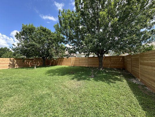 6'H Horizontal Cedar Fence with Round Galvanized Steel Posts - This homeowner was sick of their dogs getting out of their 10+ year old wooden fence, which was missing lots of pickets and falling down into their yard. They wanted something modern and fresh, and got approval from their HOA for us to install this beautiful 6'H Western Red Cedar fence with 2-3/8" round galvanized steel posts. There was a slight grade change in the yard, and in those areas we stepped the height of the fence up or down as needed. 6'H Horizontal Cedar Fence with Round Galvanized Steel Posts - This homeowner was sick of their dogs getting out of their 10+ year old wooden fence, which was missing lots of pickets and falling down into their yard. They wanted something modern and fresh, and got approval from their HOA for us to install this beautiful 6'H Western Red Cedar fence with 2-3/8" round galvanized steel posts. There was a slight grade change in the yard, and in those areas we stepped the height of the fence up or down as needed.
