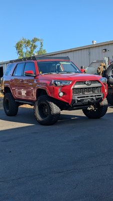 5th gen Toyota 4Runner in for a rear bumper and suspension modifications - This Customer was adding a Nguyen Works rear bumper with a swingout. We also did the custom bumper reinforcement on this truck to prevent movement in the bumper. The spring were swapped out for heavier spring rates to accommodate the rear bumper and skid plates that were installed. Icon Billet upper control arms install and a fresh off-road alignment to get this customer rear for the trail. 5th gen Toyota 4Runner in for a rear bumper and suspension modifications - This Customer was adding a Nguyen Works rear bumper with a swingout. We also did the custom bumper reinforcement on this truck to prevent movement in the bumper. The spring were swapped out for heavier spring rates to accommodate the rear bumper and skid plates that were installed. Icon Billet upper control arms install and a fresh off-road alignment to get this customer rear for the trail.