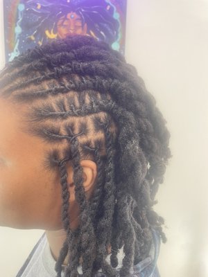 Retwist & Style 
Visit our website to book this style ! - Half up half down loc style . Barrel twist in the front and two strand twist in the back !
