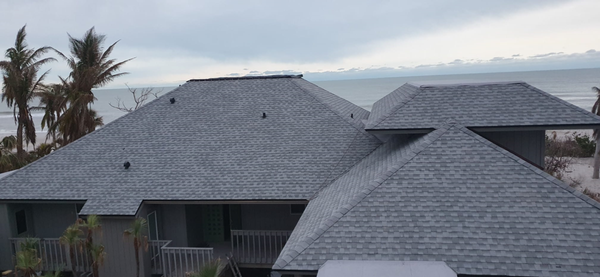 Sanibel Island, Lee County - Residential roof suffered wind damage from storm Ian.  Kancor Roofing was contractor to replace the roof using GAF shingles, birchwood color. Completed roof replacement in 3 days.