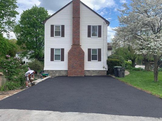 DRIVEWAY/CHIMNEY UPGRADE - Homeowners were fabulous gardeners but the decaying asphalt and facing chimney stole the show. 

Brick City leveled and poured fresh asphalt, sandblasted and repointed the chimney, and suddenly the owner's landscaping became the focus.