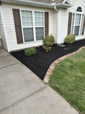 Bed clean out, weed barrier and mulch - We was hire to clean all weeds and grass from bed, install new weed barrier and black mulch Bed clean out, weed barrier and mulch - We was hire to clean all weeds and grass from bed, install new weed barrier and black mulch