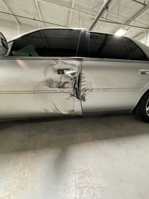 2003 Cadillac - This job was from a first time walk on customer. The drivers door was jammed closed  an torn from the front side.. we replaced the front and back doors  before replacement we noticed the used doors had small dents we fixed them as well  had the paint matched to excising paint (front fender & rear quarter panel) along with that the paint was blended into front an rear panels resulting in excellent paint match.