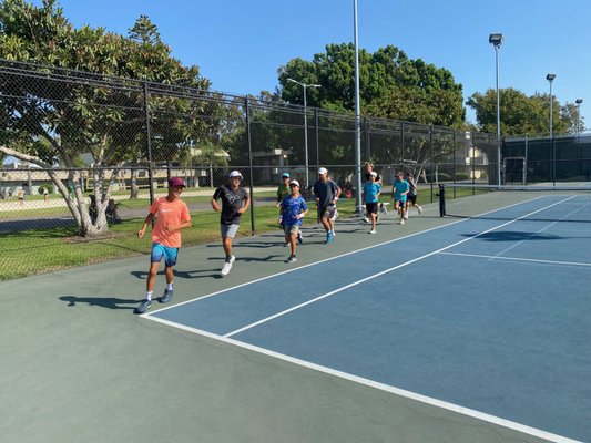 High Performance Clinic and Junior Team Tennis - By working together, our program’s #1 priority is our young protégés who are the future of tennis in our community.
The goal is for players to become competitive collegiate scholar-athletes and beyond. We believe in the process of becoming a professional in life through tennis. It is the standard in which we see our players as champions.
Building and training a holistic, healthy competitive culture, team and family of Elite Performers Inspired Competitors. High Performance Clinic and Junior Team Tennis - By working together, our program’s #1 priority is our young protégés who are the future of tennis in our community.
The goal is for players to become competitive collegiate scholar-athletes and beyond. We believe in the process of becoming a professional in life through tennis. It is the standard in which we see our players as champions.
Building and training a holistic, healthy competitive culture, team and family of Elite Performers Inspired Competitors.