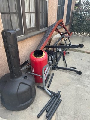 Exercise Equipment/Misc Removal - All this stuff was taking up space in the driveway, we swiftly sprung into action and provided the solution to maximizing Rebecca's space. Even including other miscellaneous items not shown in photo. We were glad to hear we went above and beyond her expectations.