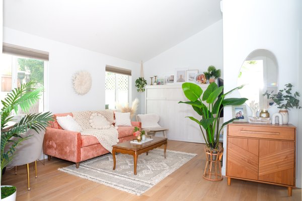 Mid-Century / Boho ADU - This ADU started as a complete blank slate. The goal was to create a space that could comfortably serve as both a rental and a welcoming spot for visiting family.

We blended heirloom keepsakes with fresh, modern pieces to create a layered mid-century/boho vibe—bright, inviting, and still warm and cozy.

To maximize functionality, we incorporated a Murphy bed with a built-in sofa, which also doubles as a clean-lined shelf/mantle for displaying meaningful photos and personal touches. The layout allows for everyday living, with a dedicated office nook and lounge area, while easily transforming into a comfortable guest space when needed.