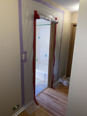 Protection - These are examples from our work as to how we currently protect the work area. We use a zip wall system to create a temporary plastic wall, or use delicate painters tape to hang plastic in odd shaped areas. This allows us to perform the work in a sealed area and limit dust to the rest of the home dramatically. If there is a window available we install a fan to create a negative air area. What the negative air area does, is cause fresh air to come from the rest of the home into the work space and the dusty air is pushed out through a window. The combination of the plastic zip walls, and negative air system allows for a nearly dustless remodel.