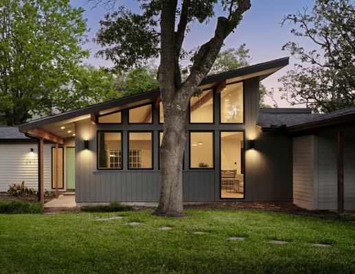 Rosedale | Mid Century Modern Addition & Full Home remodel - Full Home Remodel with Addition for a Growing Family
We're excited to showcase this stunning full home remodel and addition, completed for a young couple in anticipation of their growing family. With a baby on the way, they needed more space and a design that would accommodate their expanding needs. This project, done in collaboration with the talented Jameson Design Group, brought a major transformation to their home, infusing it with a sleek mid-century modern aesthetic.
Architectural Transformation:
One of the most significant aspects of this remodel was the complete removal and reshaping of the roofline. The new design features a modern single pitch, giving the home a fresh mid-century modern look from top to bottom. This architectural overhaul not only enhanced the home's curb appeal but also laid the foundation for a cohesive design throughout.
Spacious Common Areas:
The common areas of the home now boast high ceilings, creating an open and airy atmosphere. The kitchen, a true centerpiece, features an abundance of windows that flood the space with natural light. With a mix of stained walnut cabinets and green base cabinets, beautiful quartz countertops, and cool mid-century pendant lights, the kitchen exudes style and functionality. The straight stack backsplash and brushed brass hardware add the perfect finishing touches.
Elegant Bathrooms:
The primary bathroom showcases high ceilings, a custom walnut vanity, and brushed brass fixtures and hardware, with a walk-in shower that offers a luxurious experience. The powder bath continues the mid-century theme with a custom walnut floating vanity and a unique penny round backsplash complemented by brushed brass fixtures.
Finishing Touches:
Throughout the home, we installed 3/4” oak wood flooring, new doors, baseboards, and a fresh coat of paint, along with some stylish wallpaper accents. The attention to detail ensures every room feels connected and thoughtfully designed.
Outdoor Living:
To extend the living space, we added a custom screened-in porch in the backyard, perfect for enjoying the outdoors while being protected from the elements.
This remodel not only provided the additional space this young family needed but also transformed their home into a mid-century modern masterpiece. We are thrilled with the results and grateful to have collaborated with Jameson Design Group on this project.
Explore the gallery below to see the incredible transformation and details of this remarkable remodel!
Looking to remodel or add a home addition?
#GeneralContractor #CatalystAustin #HomeAdditions
https://catalystaustin.com/home-additions/ Rosedale | Mid Century Modern Addition & Full Home remodel - Full Home Remodel with Addition for a Growing Family
We're excited to showcase this stunning full home remodel and addition, completed for a young couple in anticipation of their growing family. With a baby on the way, they needed more space and a design that would accommodate their expanding needs. This project, done in collaboration with the talented Jameson Design Group, brought a major transformation to their home, infusing it with a sleek mid-century modern aesthetic.
Architectural Transformation:
One of the most significant aspects of this remodel was the complete removal and reshaping of the roofline. The new design features a modern single pitch, giving the home a fresh mid-century modern look from top to bottom. This architectural overhaul not only enhanced the home's curb appeal but also laid the foundation for a cohesive design throughout.
Spacious Common Areas:
The common areas of the home now boast high ceilings, creating an open and airy atmosphere. The kitchen, a true centerpiece, features an abundance of windows that flood the space with natural light. With a mix of stained walnut cabinets and green base cabinets, beautiful quartz countertops, and cool mid-century pendant lights, the kitchen exudes style and functionality. The straight stack backsplash and brushed brass hardware add the perfect finishing touches.
Elegant Bathrooms:
The primary bathroom showcases high ceilings, a custom walnut vanity, and brushed brass fixtures and hardware, with a walk-in shower that offers a luxurious experience. The powder bath continues the mid-century theme with a custom walnut floating vanity and a unique penny round backsplash complemented by brushed brass fixtures.
Finishing Touches:
Throughout the home, we installed 3/4” oak wood flooring, new doors, baseboards, and a fresh coat of paint, along with some stylish wallpaper accents. The attention to detail ensures every room feels connected and thoughtfully designed.
Outdoor Living:
To extend the living space, we added a custom screened-in porch in the backyard, perfect for enjoying the outdoors while being protected from the elements.
This remodel not only provided the additional space this young family needed but also transformed their home into a mid-century modern masterpiece. We are thrilled with the results and grateful to have collaborated with Jameson Design Group on this project.
Explore the gallery below to see the incredible transformation and details of this remarkable remodel!
Looking to remodel or add a home addition?
#GeneralContractor #CatalystAustin #HomeAdditions
https://catalystaustin.com/home-additions/