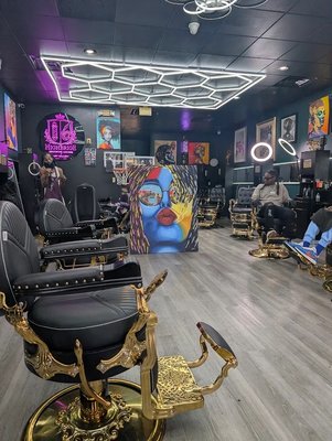 Our Space - At Highbridge One, we’re more than just a barbershop! We are a Men’s & Women’s Grooming Lounge and Art Gallery dedicated to providing an elevated experience for every client who walks through our doors. From precision cuts and beard grooming to facials, skincare treatments, loc maintenance, and more, our team is committed to helping you look and feel your best.

Whether you’re a longtime client or visiting for the first time, we invite you to experience professionalism, artistry, and top-tier service in a welcoming environment.

Each season we host the work of artists from across the DMV — woven into the rhythm of the shop.

Reserve your chair online, or speak with our concierge directly. Make sure to ask about our memberships.