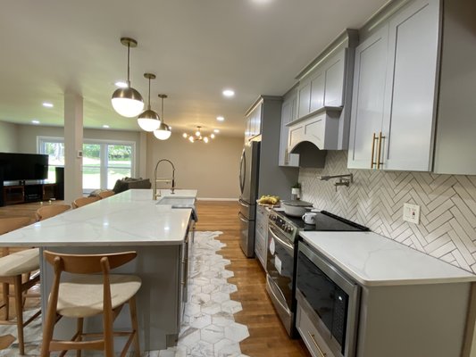 Hatfield Kitchen - For this kitchen remodel, we transformed the space into a modern, open-concept area perfect for both cooking and entertaining. We began by tearing down three walls, creating a seamless flow between the kitchen, living, and dining areas. This bold move opened up the space, making it feel brighter and more connected to the rest of the home.
A key feature of the remodel is the custom-built island at the center of the kitchen. Designed to be both functional and stylish, the island provides additional prep space, storage, and serves as a natural gathering spot. Surrounding the island, we installed elegant tile work that highlights its design and adds texture and warmth to the space.
With the walls opened up and the island as a focal point, the kitchen now feels airy, inviting, and perfect for modern living. The flow between spaces has been maximized, making it ideal for family meals or entertaining guests. Hatfield Kitchen - For this kitchen remodel, we transformed the space into a modern, open-concept area perfect for both cooking and entertaining. We began by tearing down three walls, creating a seamless flow between the kitchen, living, and dining areas. This bold move opened up the space, making it feel brighter and more connected to the rest of the home.
A key feature of the remodel is the custom-built island at the center of the kitchen. Designed to be both functional and stylish, the island provides additional prep space, storage, and serves as a natural gathering spot. Surrounding the island, we installed elegant tile work that highlights its design and adds texture and warmth to the space.
With the walls opened up and the island as a focal point, the kitchen now feels airy, inviting, and perfect for modern living. The flow between spaces has been maximized, making it ideal for family meals or entertaining guests.