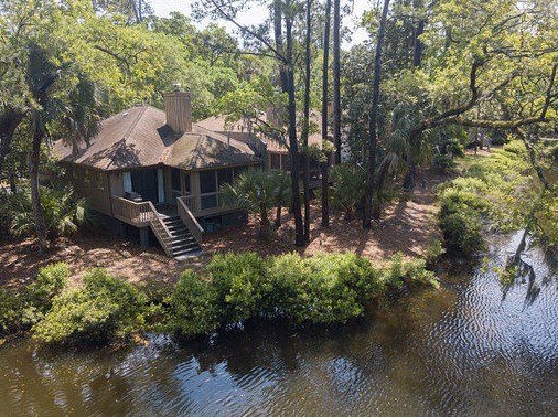 1210 Flying Squirrel Ct, Johns Island, SC 29455 - 1210 Flying Squirrel CT is an elegantly updated, turnkey cottage located at the end of a cul-de-sac with 2 designated parking spots, adjacent to Cougar Point Golf Course. Upon entering this luxurious home, you will be greeted with a bright, open floor plan with panoramic views of the lagoon. This home has been professionally remodeled and decorated to provide a true low country feel. It offers local artisan paintings and oriental rugs making it an ideal space for entertaining or relaxing after enjoying Kiawah's world-class amenities and restaurants. Expansive upgrades include a new kitchen with stainless steel appliances; fully remodeled bathrooms, hardwood floors, custom trim work and wainscoting, tray ceiling in the living room, windows, HVAC, electrical and fixtures. The cottage is ideally located just minutes from the beach or community pool. Enjoy Kiawah's wildlife while seated on the deck or screened-in porch! 1210 Flying Squirrel Ct, Johns Island, SC 29455 - 1210 Flying Squirrel CT is an elegantly updated, turnkey cottage located at the end of a cul-de-sac with 2 designated parking spots, adjacent to Cougar Point Golf Course. Upon entering this luxurious home, you will be greeted with a bright, open floor plan with panoramic views of the lagoon. This home has been professionally remodeled and decorated to provide a true low country feel. It offers local artisan paintings and oriental rugs making it an ideal space for entertaining or relaxing after enjoying Kiawah's world-class amenities and restaurants. Expansive upgrades include a new kitchen with stainless steel appliances; fully remodeled bathrooms, hardwood floors, custom trim work and wainscoting, tray ceiling in the living room, windows, HVAC, electrical and fixtures. The cottage is ideally located just minutes from the beach or community pool. Enjoy Kiawah's wildlife while seated on the deck or screened-in porch!