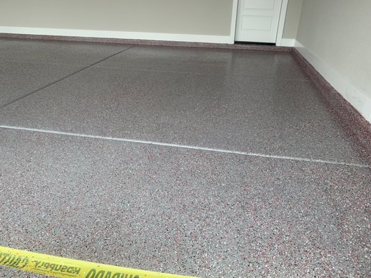 Industrial Epoxy Floor - This is a concrete garage floor epoxy and poly urethane concrete sealer with wht, red, blk, and gray color flakes. The epoxy is solvent based industrial grade epoxy.  These floors last a life time.  Concrete Restored is a decorative concrete floor coating contractor. Specializing in concrete staining, concrete sealing, Epoxy, concrete polishing, resilient concrete, pool deck coating, paver sealing, concrete cleaning, and pressure washing.  Concrete Restored offers these specialties on walkways, side walks, patios, courtyards, driveways, garage floors, business floors, pool decks, commercial store fronts, residential home floors, concrete floors, and ware houses. Concrete Restored only uses the best materials from sherwin Williams, PPG, Dunn Edward’s, Behr, Home Depot, Lowe’s, concrete Accessaries, calico acrylic urethane, Arizona Poly urethane, Daaramen’s and smith Stains