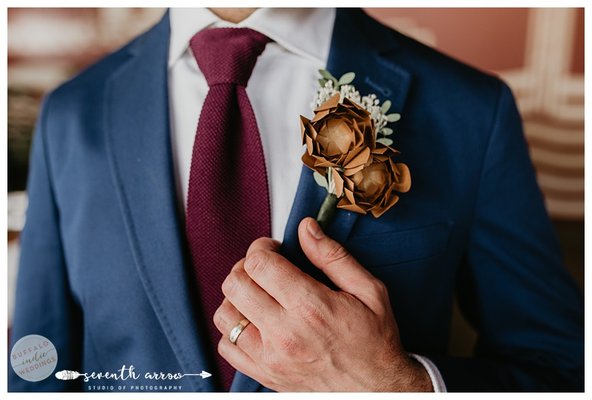 Corsages & Boutonnieres - At Papercraft Miracles, we specialize in all things paper, including handmade boutonnières and corsages made from crepe paper flowers.
Not only are these flowers striking and vibrant, they are crafted by hand and built to last. No need to worry about fresh flowers all day, especially when you're wearing them! You can be confident that our hand crafted boutonnieres and corsages are as sturdy as they are beautiful. Corsages & Boutonnieres - At Papercraft Miracles, we specialize in all things paper, including handmade boutonnières and corsages made from crepe paper flowers.
Not only are these flowers striking and vibrant, they are crafted by hand and built to last. No need to worry about fresh flowers all day, especially when you're wearing them! You can be confident that our hand crafted boutonnieres and corsages are as sturdy as they are beautiful.