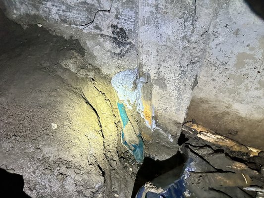 Emergency Drain Install - We got an emergency call on Christmas Day, our client had 3’ of standing water in their basement. After repairing the sump pump they found a hole under their foundation that you could have put your entire arm through. They patched the hole and then we came in and installed a footing drain for them. While we were excavating we found some interesting previous work underground. We addressed the previous installations and then installed the footing drain we agreed to with no additional costs. When we were all done with our work we topped the area with straw and cleaned up the driveway, street, and sidewalk. One more happy customer! Emergency Drain Install - We got an emergency call on Christmas Day, our client had 3’ of standing water in their basement. After repairing the sump pump they found a hole under their foundation that you could have put your entire arm through. They patched the hole and then we came in and installed a footing drain for them. While we were excavating we found some interesting previous work underground. We addressed the previous installations and then installed the footing drain we agreed to with no additional costs. When we were all done with our work we topped the area with straw and cleaned up the driveway, street, and sidewalk. One more happy customer!