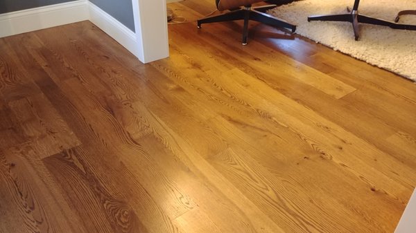 Hardwood Floor - This project was a total gut of a living room and dining room floor. The existing carpet and hardwood was removed and some of the subfloor was replaced and then brought up to a proper height for the front door and kitchen floors. New hardwood flooring was installed and finished. Then baseboards and trim was installed. Hardwood Floor - This project was a total gut of a living room and dining room floor. The existing carpet and hardwood was removed and some of the subfloor was replaced and then brought up to a proper height for the front door and kitchen floors. New hardwood flooring was installed and finished. Then baseboards and trim was installed.