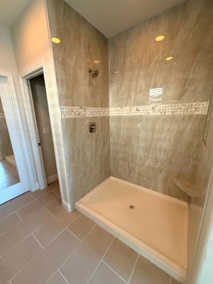 Bathroom Remodel - This remodel was done from complete, new tiles, shower panel and a trim to add a touch of contrast. Bathroom Remodel - This remodel was done from complete, new tiles, shower panel and a trim to add a touch of contrast.