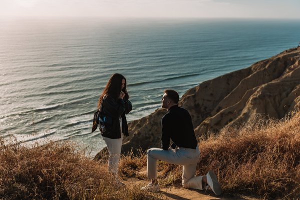 Engagement Proposals - Are you searching for the best San Diego Engagement Proposal Photographer to document your once-in-a-lifetime moment? Brandon Colbert Photography specializes in capturing surprise proposals with unmatched artistry and authenticity.
As a trusted San Diego engagement photographer, Brandon blends his deep local knowledge with a passion for storytelling to ensure your proposal is beautifully documented in breathtaking locations. Whether you envision popping the question on the stunning beaches of La Jolla, a scenic sea cliff, coastal overlook, or a hidden gem in San Diego, Brandon knows exactly how to create the perfect setting for an unforgettable moment.
Experience & Expertise – With years of engagement and proposal photography experience and a degree from the Brooks Institute of Photography, Brandon knows how to capture your love story with professionalism and skill. Plus, as someone who remembers his own proposal moment vividly, he understands just how important this day is for you!
Authentic & Natural Moments – His journalistic approach ensures that every reaction, emotion, and joyful tear is captured in a timeless and heartfelt way!
Stress-Free & Seamless Experience – From planning the perfect shot to executing a flawless surprise, Brandon makes the process smooth, fun, and enjoyable for you and yours!
Helpful Guidance & Suggestions – Not sure how to make the moment perfect? Brandon offers expert advice and suggestions to ensure you feel confident, prepared, and relaxed, so you can focus on saying what truly matters and being present in the moment!
Your engagement is a milestone you’ll cherish forever. Trust Brandon Colbert Photography, San Diego’s best engagement proposal photographer, to capture the magic of your love story.
Book your San Diego engagement proposal photographer today! Engagement Proposals - Are you searching for the best San Diego Engagement Proposal Photographer to document your once-in-a-lifetime moment? Brandon Colbert Photography specializes in capturing surprise proposals with unmatched artistry and authenticity.
As a trusted San Diego engagement photographer, Brandon blends his deep local knowledge with a passion for storytelling to ensure your proposal is beautifully documented in breathtaking locations. Whether you envision popping the question on the stunning beaches of La Jolla, a scenic sea cliff, coastal overlook, or a hidden gem in San Diego, Brandon knows exactly how to create the perfect setting for an unforgettable moment.
Experience & Expertise – With years of engagement and proposal photography experience and a degree from the Brooks Institute of Photography, Brandon knows how to capture your love story with professionalism and skill. Plus, as someone who remembers his own proposal moment vividly, he understands just how important this day is for you!
Authentic & Natural Moments – His journalistic approach ensures that every reaction, emotion, and joyful tear is captured in a timeless and heartfelt way!
Stress-Free & Seamless Experience – From planning the perfect shot to executing a flawless surprise, Brandon makes the process smooth, fun, and enjoyable for you and yours!
Helpful Guidance & Suggestions – Not sure how to make the moment perfect? Brandon offers expert advice and suggestions to ensure you feel confident, prepared, and relaxed, so you can focus on saying what truly matters and being present in the moment!
Your engagement is a milestone you’ll cherish forever. Trust Brandon Colbert Photography, San Diego’s best engagement proposal photographer, to capture the magic of your love story.
Book your San Diego engagement proposal photographer today!