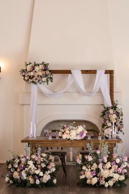 Wedding Flowers - Two different style wedding at the same venue. Each with their own unique style and beauty. One has a splash of spring colors and the other simply white. Both wedding came out stunning and elegant. We here at Little Blue Hummingbird cater to all style of weddings. Our team of professionals work together to bring magic to all of our events.