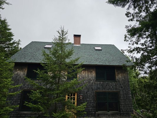 Acadia Salt Box - We removed some IKO Cambridge shingles from this beautiful saltbox home, they were applied only 16 years ago and had begun to cup upwards and disintegrate. 
Afterward we applied Owens Corning Duration Chateau Green and brought this home back to its original glory!