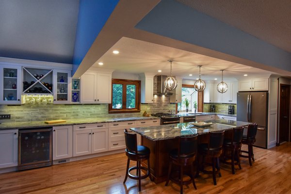 Open Concept Kitchen - This kitchen remodel project showcases an impressive transformation from a dated, enclosed space to a bright, open-concept culinary haven. During construction, we completely gutted the kitchen, removing walls to create an open layout that seamlessly integrates with the dining area. The final design features modern white cabinetry, elegant granite countertops, and state-of-the-art stainless steel appliances. The island serves as a functional centerpiece, offering ample seating and workspace. With contemporary lighting fixtures and a stylish backsplash, this kitchen is now a perfect blend of functionality and aesthetic appeal, ready to host family gatherings and culinary adventures. Open Concept Kitchen - This kitchen remodel project showcases an impressive transformation from a dated, enclosed space to a bright, open-concept culinary haven. During construction, we completely gutted the kitchen, removing walls to create an open layout that seamlessly integrates with the dining area. The final design features modern white cabinetry, elegant granite countertops, and state-of-the-art stainless steel appliances. The island serves as a functional centerpiece, offering ample seating and workspace. With contemporary lighting fixtures and a stylish backsplash, this kitchen is now a perfect blend of functionality and aesthetic appeal, ready to host family gatherings and culinary adventures.