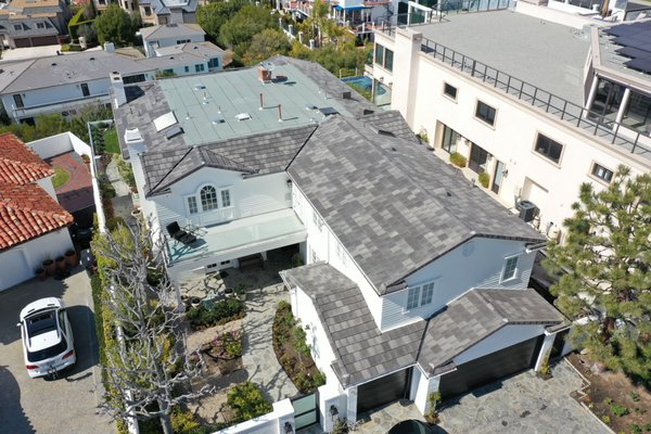 Tile Installation - This beautiful home in Newport Beach was experiencing multiple leaks. The client wanted something modern yet easily maintained. After conducting an engineering feasibility report with load calculations to ensure the existing structure could support additional weight we opted for Boral's blended 600 tiles. The end result speaks for itself. Tile Installation - This beautiful home in Newport Beach was experiencing multiple leaks. The client wanted something modern yet easily maintained. After conducting an engineering feasibility report with load calculations to ensure the existing structure could support additional weight we opted for Boral's blended 600 tiles. The end result speaks for itself.