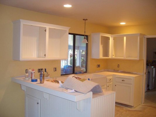 Kitchen cabinet remodel - This was new kitchen cabinets which was installed new and raw. They were primed with two coat and two coats of an interior semi-gloss enamel.