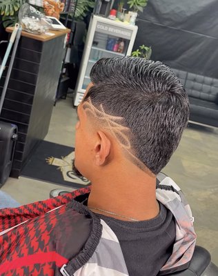 "Fresh Looks, Every Time" - With a steady hand and a keen eye for style, our barber isn’t just cutting hair—they’re crafting confidence. Effortlessly blending classic skill with modern trends, they make every visit an experience. Cool, creative, and always on point—that’s the barber everyone’s talking about. "Fresh Looks, Every Time" - With a steady hand and a keen eye for style, our barber isn’t just cutting hair—they’re crafting confidence. Effortlessly blending classic skill with modern trends, they make every visit an experience. Cool, creative, and always on point—that’s the barber everyone’s talking about.
