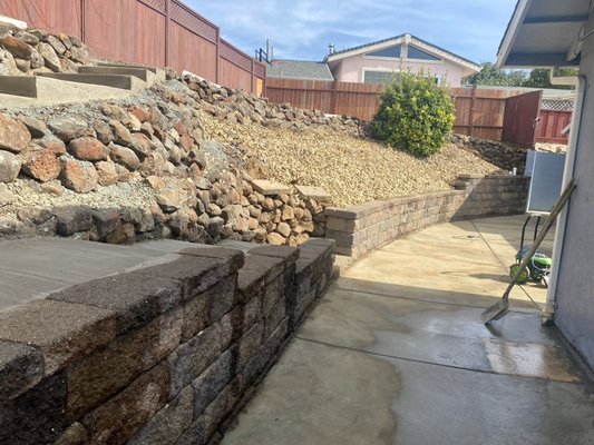 Retaining Wall with concrete steps. - Here we installed retaining wall to retain the dirt if this back yard area. We also installed concrete steps providing accessibility to the top of the yard. Retaining Wall with concrete steps. - Here we installed retaining wall to retain the dirt if this back yard area. We also installed concrete steps providing accessibility to the top of the yard.