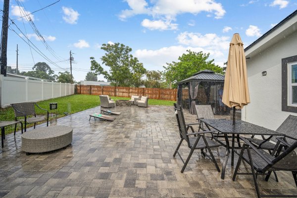 Beautifully Functional - Transform your property with a beautiful and functional hardscape. Take a look at the before and after photos of this project! Gray/charcoal pavers with a charcoal border. Beautifully Functional - Transform your property with a beautiful and functional hardscape. Take a look at the before and after photos of this project! Gray/charcoal pavers with a charcoal border.