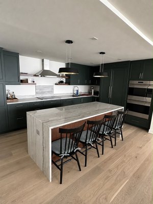 Forest Green Kitchen Remodel - Our clients had just purchased their condo and wanted to create a more open and inviting space for entertaining family and friends. We transformed the closed-concept kitchen into an open-concept layout by removing a wall, redesigning the kitchen configuration, relocating the appliances, and installing new flooring throughout. The result is a spacious, functional kitchen that connects naturally with the living area and makes entertaining much easier. Forest Green Kitchen Remodel - Our clients had just purchased their condo and wanted to create a more open and inviting space for entertaining family and friends. We transformed the closed-concept kitchen into an open-concept layout by removing a wall, redesigning the kitchen configuration, relocating the appliances, and installing new flooring throughout. The result is a spacious, functional kitchen that connects naturally with the living area and makes entertaining much easier.