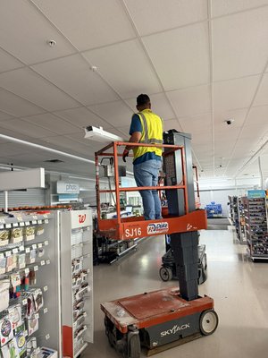 Commercial Retail Lighting Upgrade & Fixture Installation - Commercial lighting upgrade completed in an active retail facility. Work included removal and replacement of ceiling-mounted and suspended light fixtures, installation and alignment of new lighting, and final testing to provide brighter, more efficient, and uniform illumination throughout the space. Commercial Retail Lighting Upgrade & Fixture Installation - Commercial lighting upgrade completed in an active retail facility. Work included removal and replacement of ceiling-mounted and suspended light fixtures, installation and alignment of new lighting, and final testing to provide brighter, more efficient, and uniform illumination throughout the space.