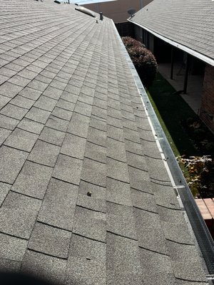 This project was a budget friendly way to keep Gutter Maintenance to a minimum by installing Gutter Guard over the Gutters - This home was a perfect candidate for Gutter Guards given the established trees surrounding the home. Without regular maintenance your Gutters and downspouts can get clogged after a season of falling leaves. It’s not a concern if your don’t have large tress surrounding your home however clogged Gutters can cause damage to the roof and soffits. Rainfall with nowhere to go will overwhelm the Gutters. In severe cases if will make its way past the roof drip edge and cause the decking to sustain water damage, leading to rot that most insurance companies will not cover. This project was a budget friendly way to keep Gutter Maintenance to a minimum by installing Gutter Guard over the Gutters - This home was a perfect candidate for Gutter Guards given the established trees surrounding the home. Without regular maintenance your Gutters and downspouts can get clogged after a season of falling leaves. It’s not a concern if your don’t have large tress surrounding your home however clogged Gutters can cause damage to the roof and soffits. Rainfall with nowhere to go will overwhelm the Gutters. In severe cases if will make its way past the roof drip edge and cause the decking to sustain water damage, leading to rot that most insurance companies will not cover.