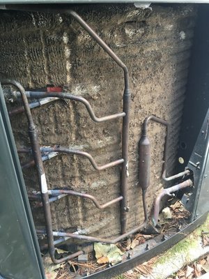 Maintenance of Outside Air Conditioning Unit - Before and after pictures of annual maintenance on an outside air conditioning condensing unit.